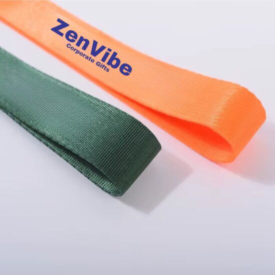 Two fabric wristbands, one orange with text and one green.