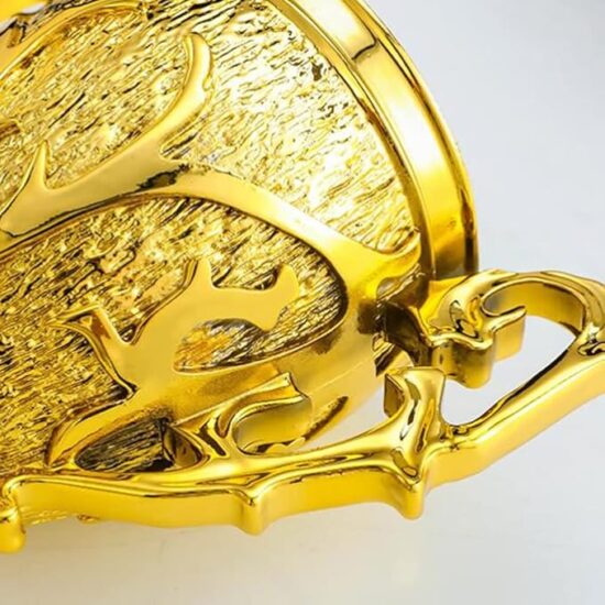 Close-up of an ornate, golden decorative object with intricate details.