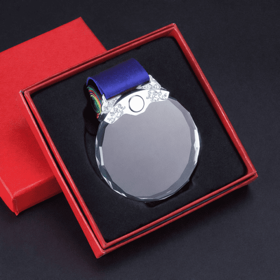 Crystal medal with blue ribbon in red box